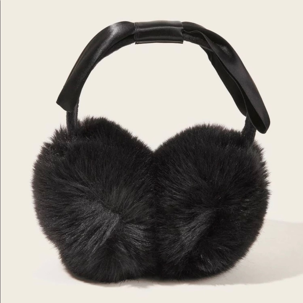 New in packing. Black Faux Earmuffs with Satin Bow New in the Original Packaging